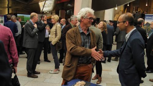 Colleagues shaking hands at an event