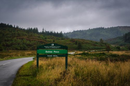 Picturesque asphalt road in Loch Lomond and Trossachs National Park, Scotland