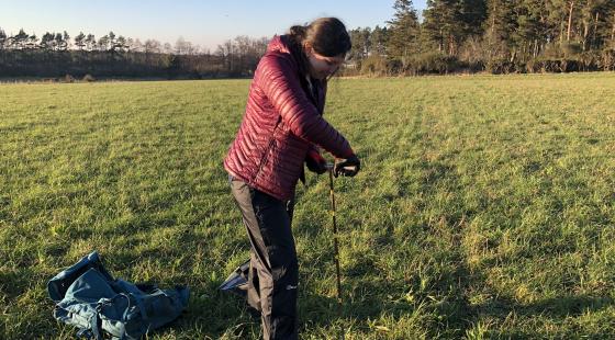 Taking a soil sample. Photo credit: Amy Cooper